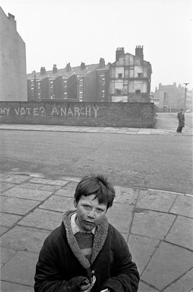 Young lad on the corner of a Liverpool 8 street, 1969